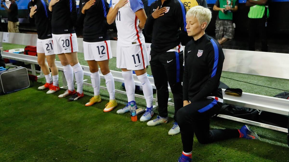 Megan Rapinoe kneels during the national anthem prior to a match between the U.S. and the Netherlands on Sept. 18.