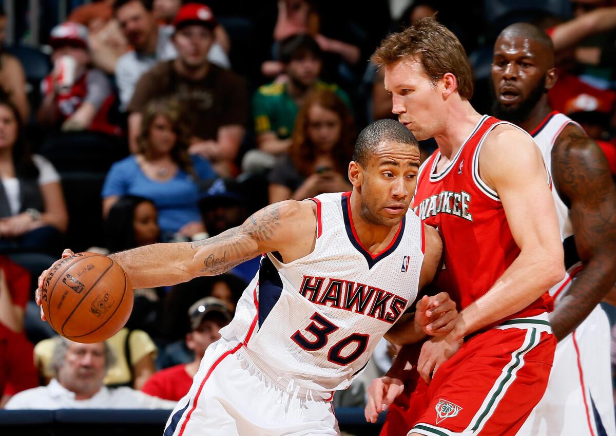 Atlanta's Dahntay Jones is called for a foul against Milwaukee's Mike Dunleavy during a game on April 12, 2013.
