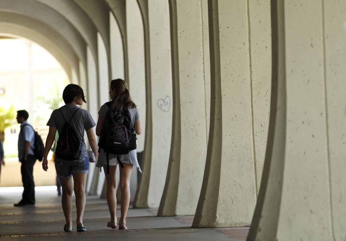 Students at San Diego State University walk on campus. The Delta Sigma Phi fraternity has been banned after some of its members allegedly harassed marchers during a Take Back the Night event.
