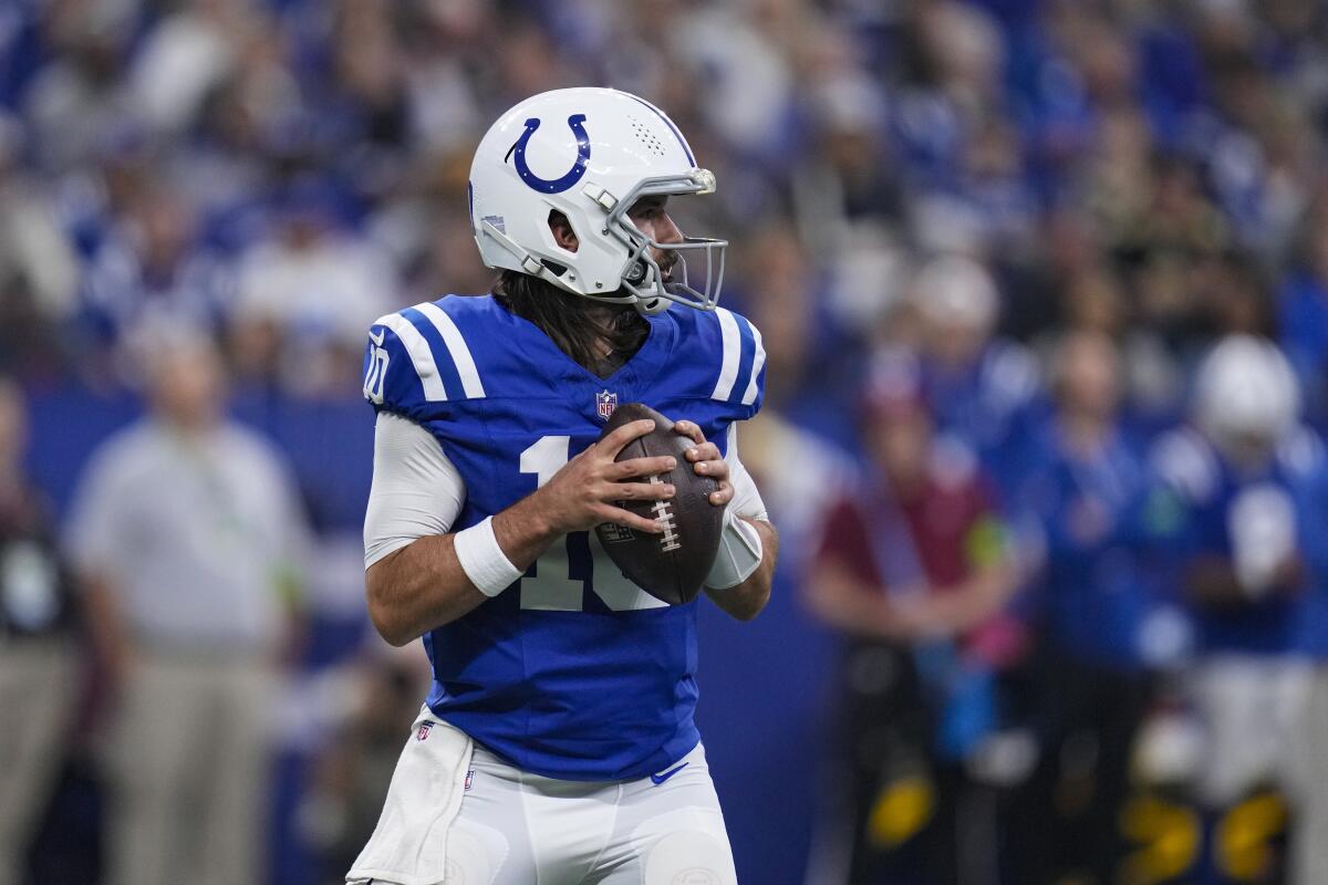 Colts quarterback Gardner Minshew (10) looks to pass against the Saints.