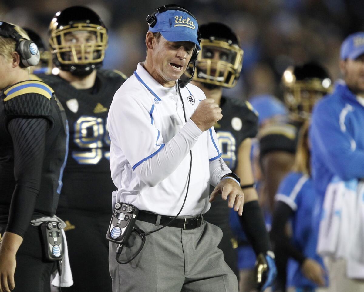 UCLA Coach Jim Mora reacts after a fumble recovery by the Bruins during a win over Washington in November. Mora and the Bruins want to put last year's bowl loss to Baylor behind them with a win over Virginia Tech in the Sun Bowl.