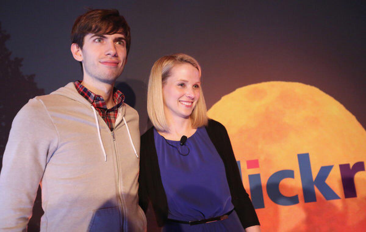 Tumblr founder David Karp poses after a news conference with Yahoo CEO Marissa Mayer.