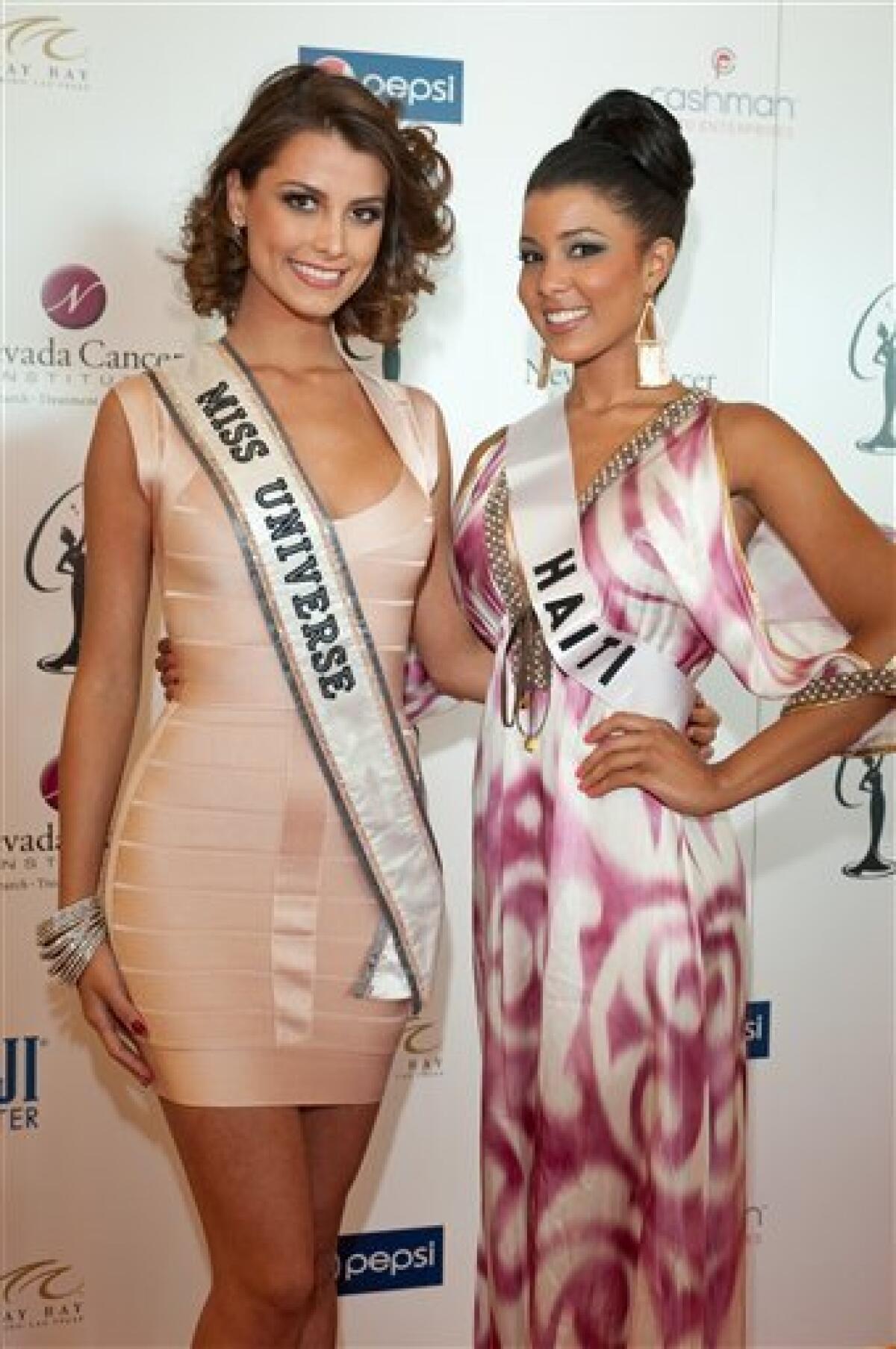 In this image provided by the Miss Universe Organization, Stefania Fernandez, Miss Universe 2009, and Sarodj Bertin, Miss Haiti 2010, arrive at the Miss Universe National Gift Auction to Benefit Nevada Cancer Institute at Mandalay Bay Resort and Casino in Las Vegas, Nevada on Saturday, Aug. 14, 2010. The Miss Universe 2010 competition that will air live Aug. 23, 2010. (AP Photo/Miss Universe Organization)