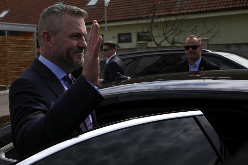 Presidential candidate Peter Pellegrini, who currently serves as Parliament's speaker, waves after casting his vote in a presidential runoff in Rovinka, Slovakia, Saturday, April 6, 2024. (AP Photo/Petr David Josek)