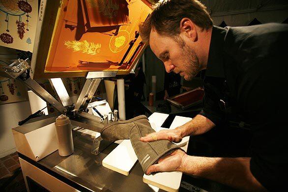 Fresh Pressed's Jonathan Sample is silkscreening an Ugg boot with artwork by Shepard Fairey.