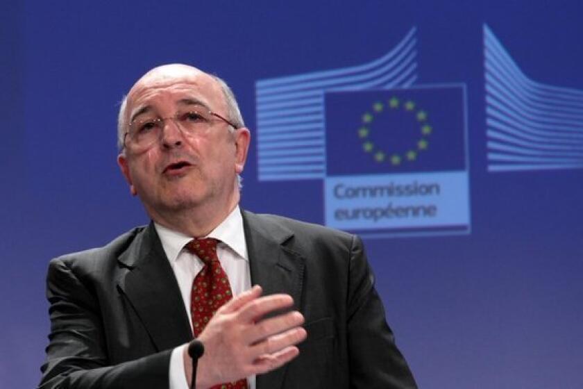 Joaquin Almunia, the European commissioner for competition, speaks at a news conference in Brussels after the European Commission fined Microsoft for non-compliance with browser choice commitments.