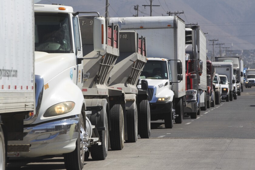 Commercial trucks wait in line to cross at the Otay Mesa Port of Entry on Friday, August 30, 2019 in Tijuana, Mexico.