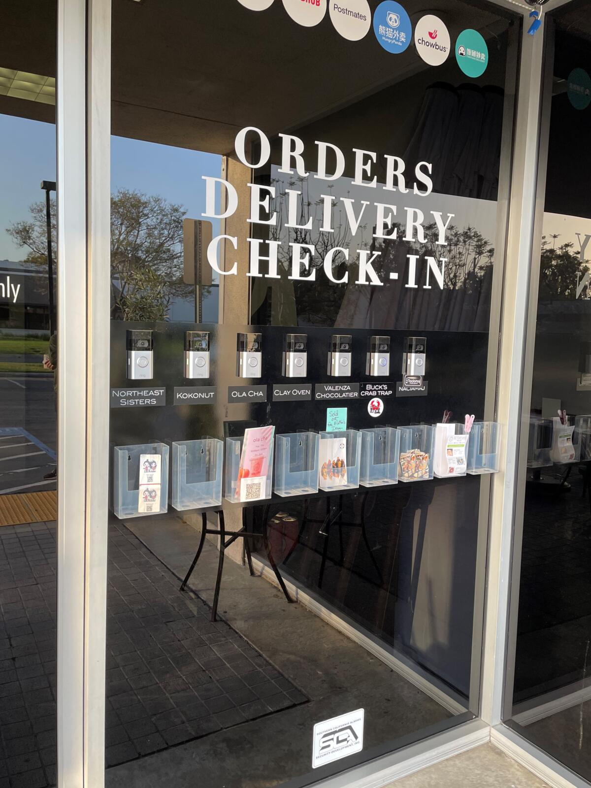 Call buttons on the door outside the Hood in Costa Mesa, where one will find Buck’s Crab Trap Kitchen.