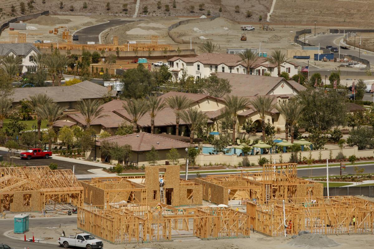 Pending home sales slipped in February for the eighth straight month, a trade group said Thursday. Above, homes under construction last year at Rancho Mission Viejo in Orange County.