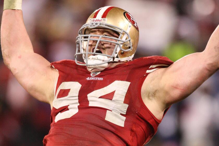 San Francisco 49ers defensive end Justin Smith celebrates a sack during an NFC Championship win over the New York Giants on Jan. 22, 2012.