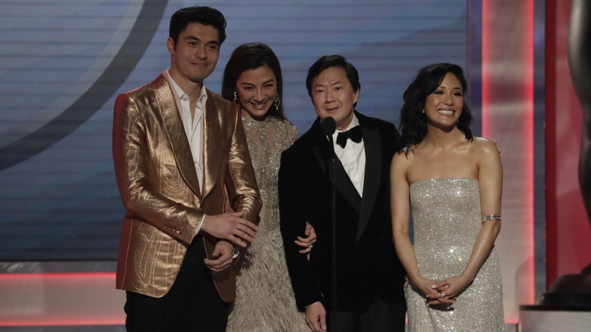 Henry Golding, from left, Michelle Yeoh, Ken Jeong and Constance Wu at the 25th Screen Actors Guild Awards on Sunday at the Los Angeles Shrine Auditorium and Expo Hall.