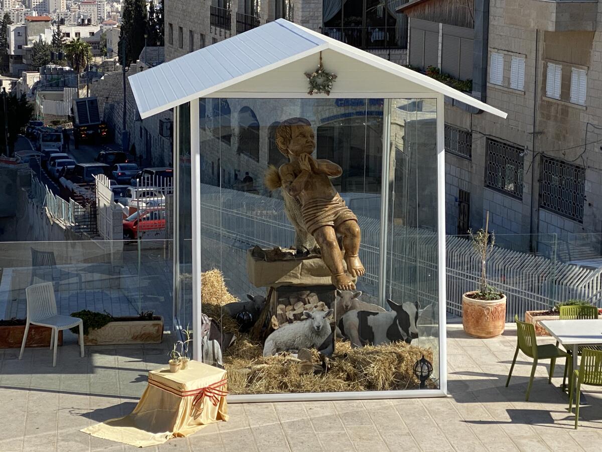 A modern creche depicts the baby Jesus in Bethlehem, the West Bank town in which he is believed to have been born.