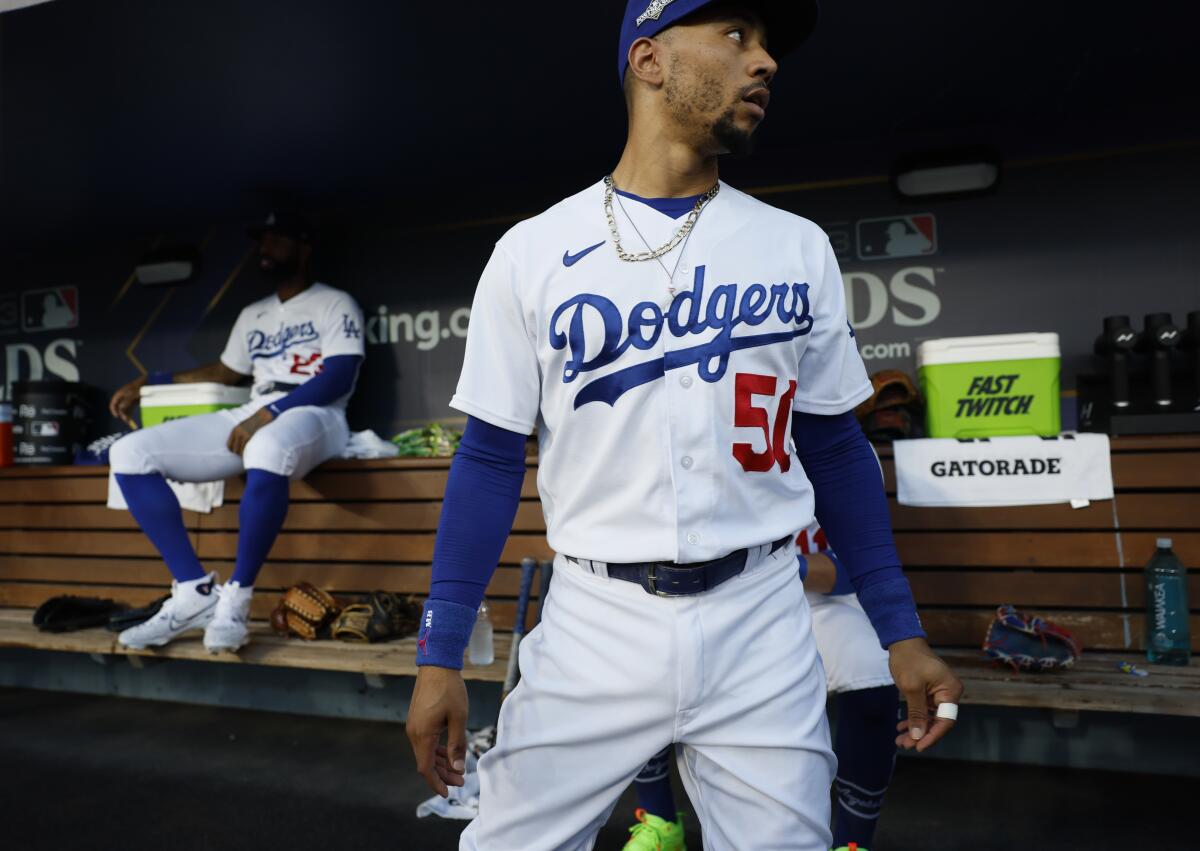 Dodgers second baseman Mookie Betts stands in the dugout before Game 1 of the NLDS against the Diamondbacks.