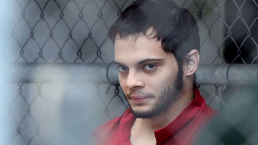 Esteban Santiago is taken from the Broward County main jail for transport to the federal courthouse in Fort Lauderdale, Florida, on Jan. 9, 2017.