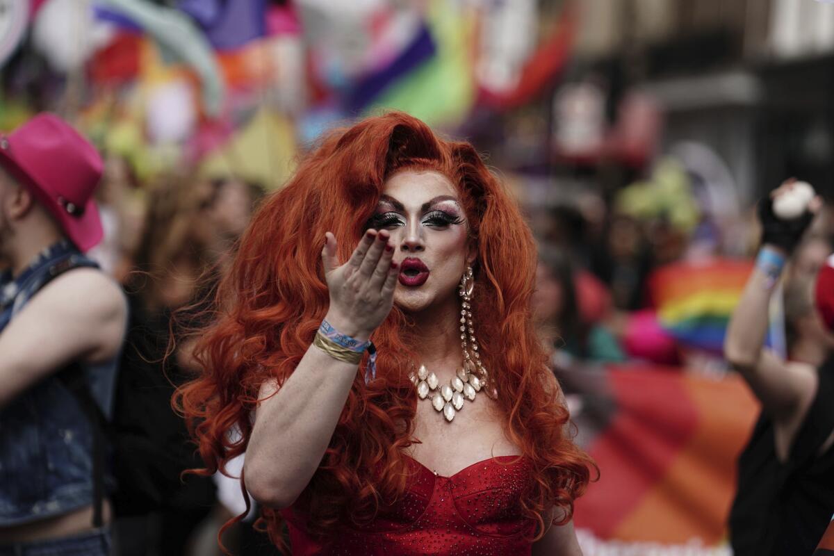 People gather to take part in the Pride in London parade Saturday.