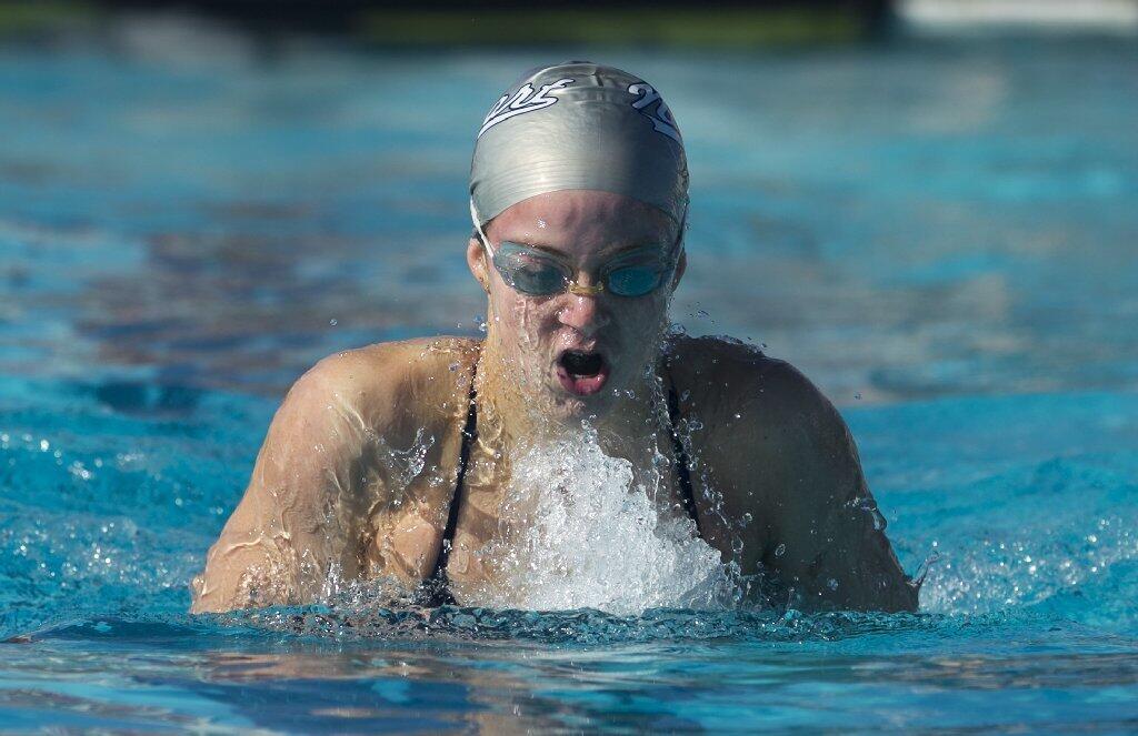 Newport Harbor High's Ayla Spitz swims the breaststroke in the 200-yard individual medley during a Sunset League meet against Los Alamitos on Tuesday.