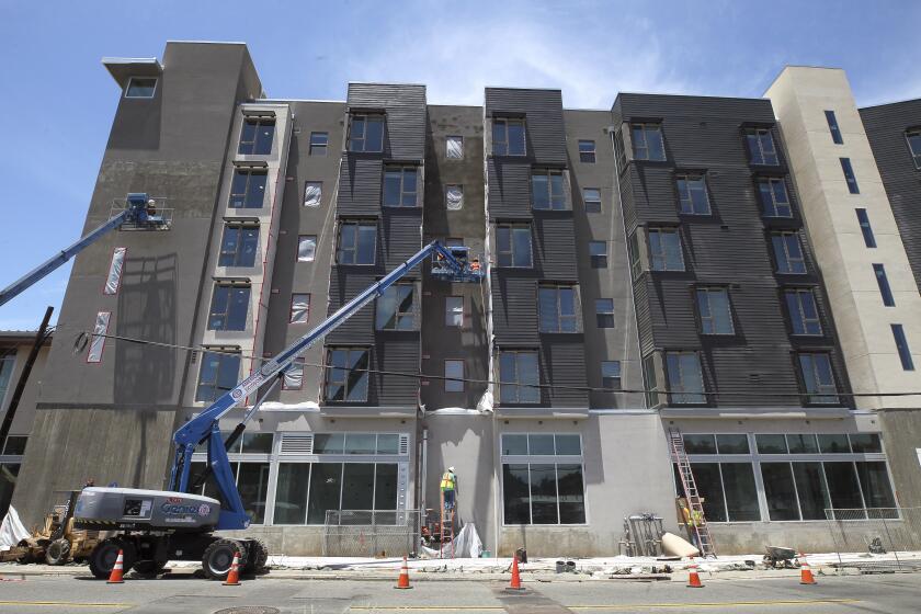 A construction worker works on The Stella, an 85-unit building for homeless veterans currently under construction in the Grantville neighborhood on Tuesday, June 11, 2019 in San Diego, California.
