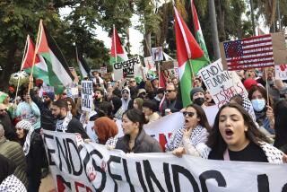 Protesters chant during the March and Rally to End the Genocide in Gaza on Saturday, December 23, 2023 in Balboa Park. The rally was put on by the American Arab Anti-Descrimination Committee.(Photo by Sandy Huffaker for The San Diego Union-Tribune