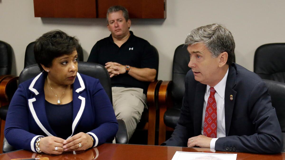 U.S. Atty. Gen. Loretta Lynch meets with U.S. Atty. Lee Bentley at the Orlando FBI office for a briefing on the Pulse nightclub mass shooting.