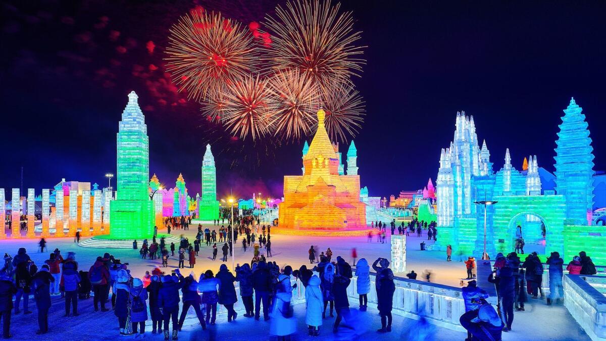 Fireworks explode over the illuminated ice sculptures on opening day of the Harbin International Ice and Snow Festival this year.