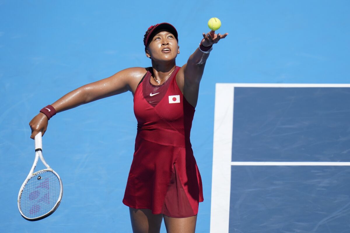 Naomi Osaka serves during her first-round win over Zheng Saisai.
