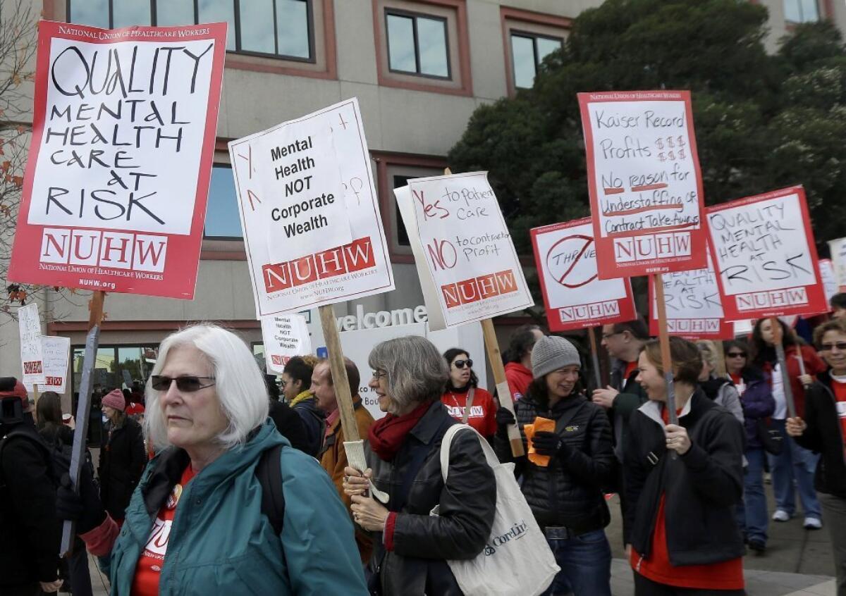 Hundreds of mental health professionals picketed outside a Kaiser Permanente facility last month calling for increased staffing of therapists and psychiatrists.