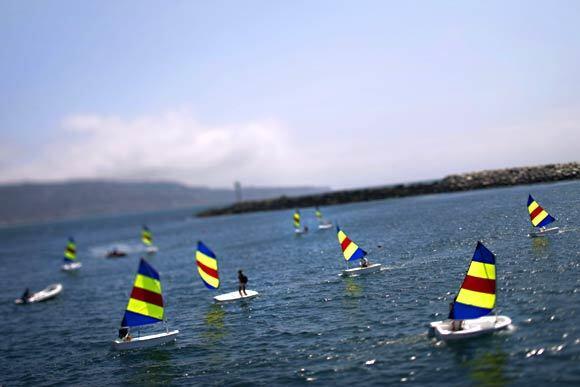 Participants in the King Harbor Youth Foundation's summer sailing program navigate through waters inside King Harbor in Redondo Beach.