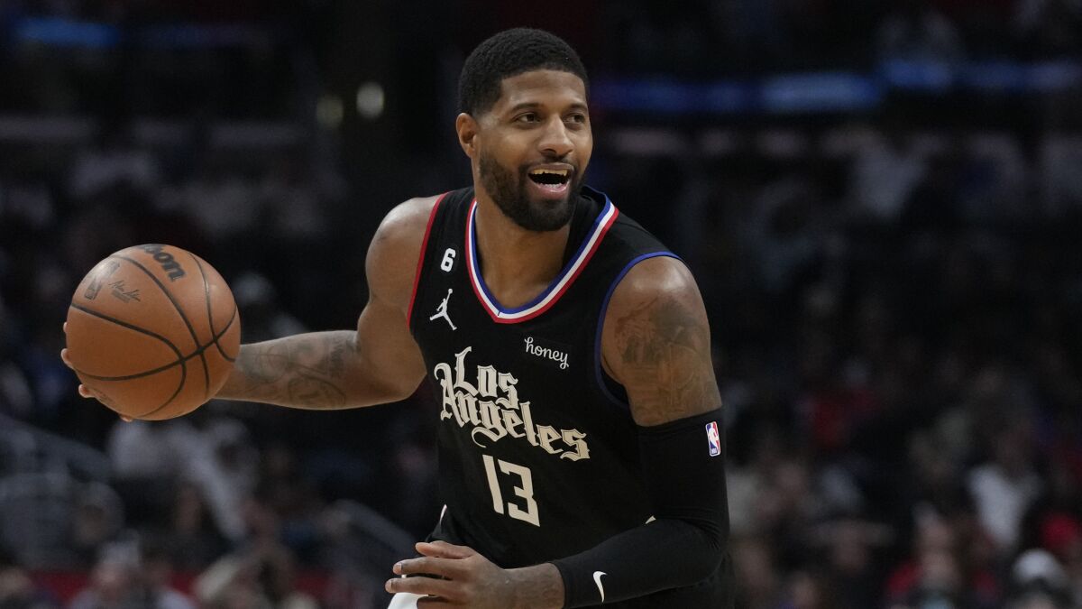Clippers guard Paul George controls the ball during a game against the San Antonio Spurs.
