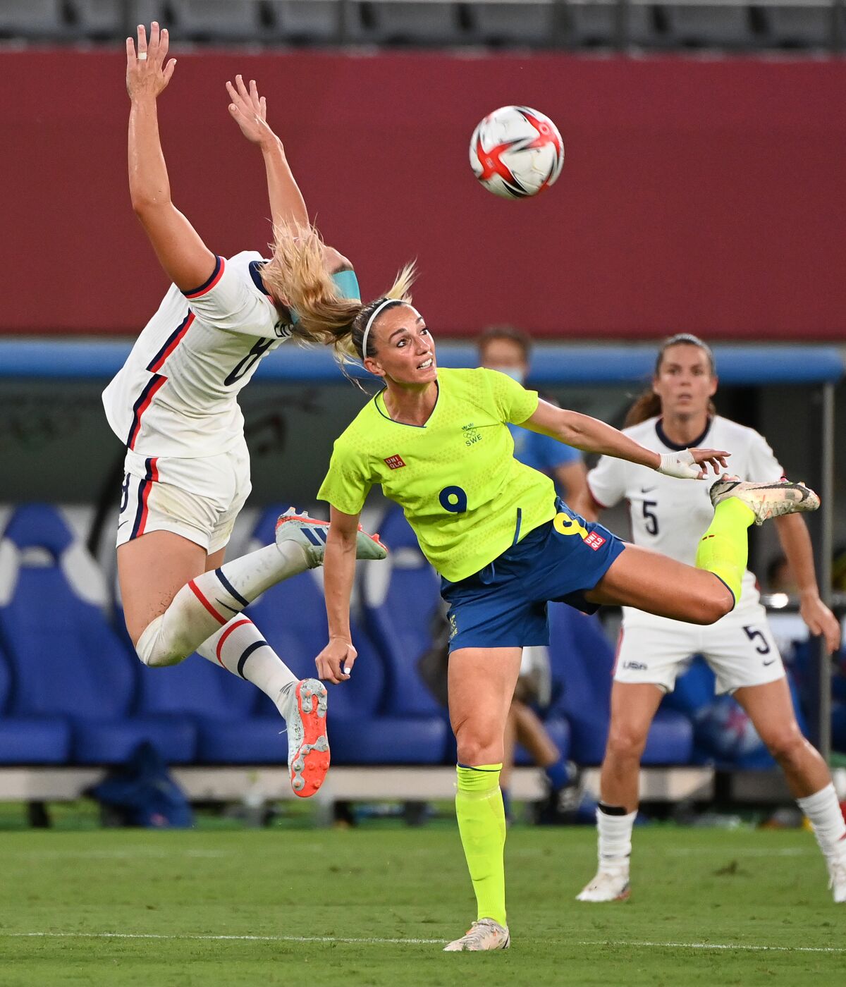 Team USA's Julie Ertz battles for the ball with Sweden's Kosovare Asllani.