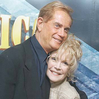 Troy Donahue and Sandra Dee, stars of the 1959 teen romance film, "A Summer Place," hug in a theater in New York's Rockefeller Center in a 1997 reunion.