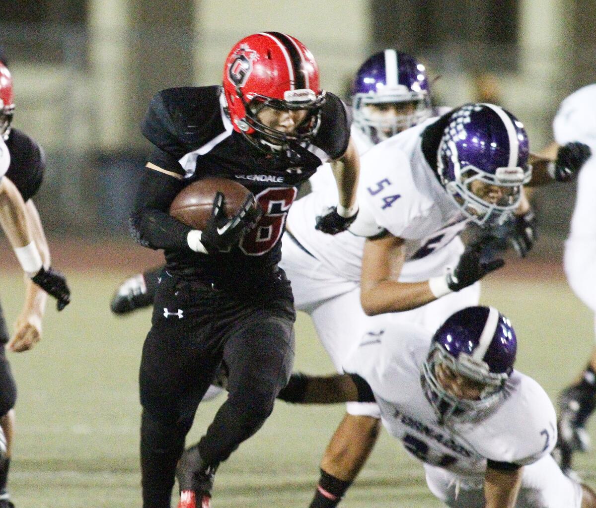 Glendale's Daniel Jung carries the ball against Hoover during a homecoming football game in a Pacific League contest on Friday, November 8, 2013. The two teams renew their rivalry Friday night at Moyse Field.