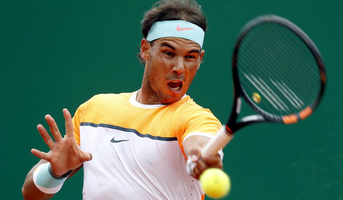 Rafael Nadal returns a shot against Lucas Pouille in the Monte Carlos Masters tournament on Wednesday.
