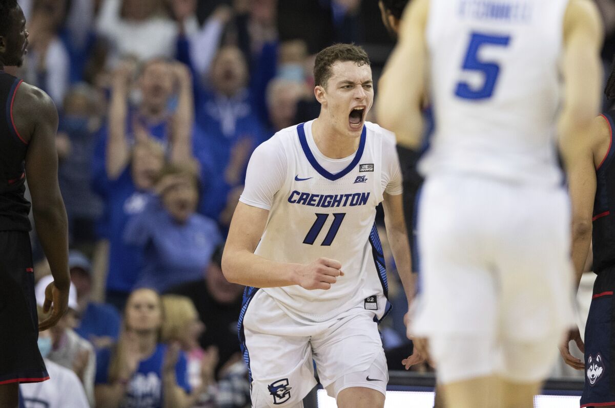 Creighton's Ryan Kalkbrenner (11) celebrates after scoring against Connecticut during the second half of an NCAA college basketball game Wednesday, March 2, 2022, in Omaha, Neb. (AP Photo/Rebecca S. Gratz)