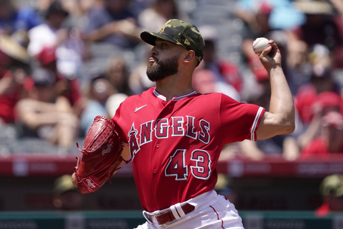 Angels starting pitcher Patrick Sandoval throws to the plate during the second inning of the Angels' 4-1 victory Sunday.