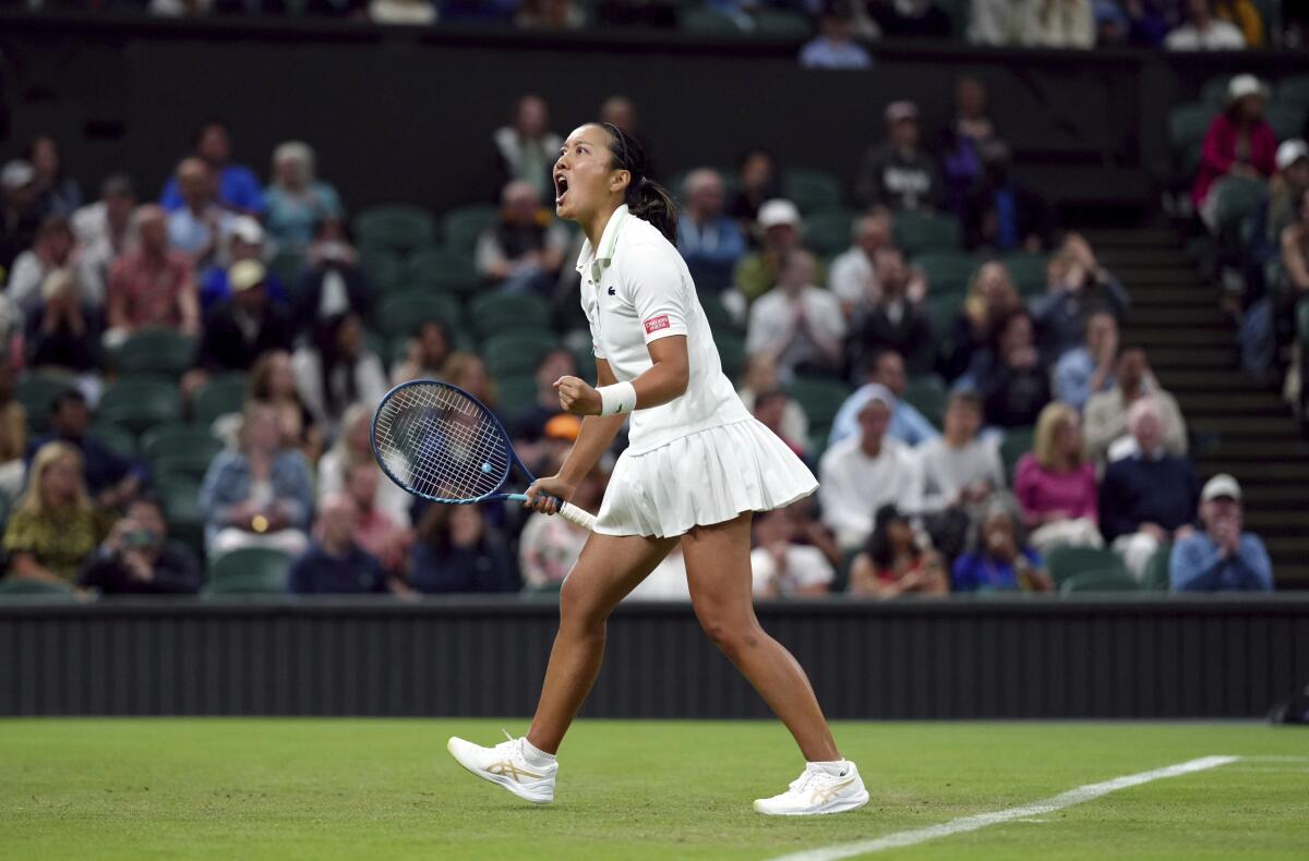 Harmony Tan reacts after winning a point against Serena Williams during their first-round match at Wimbledon on Tuesday.