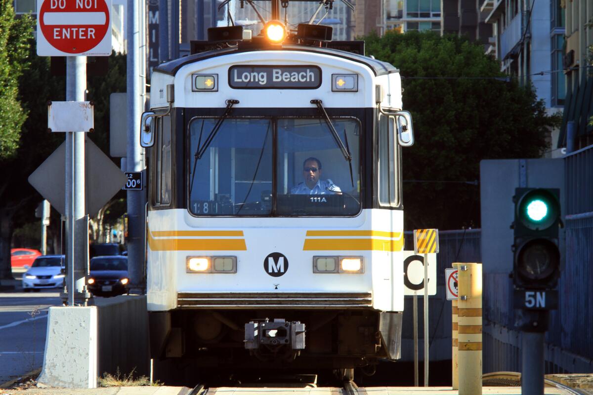 A Metro train with a Long Beach destination sign
