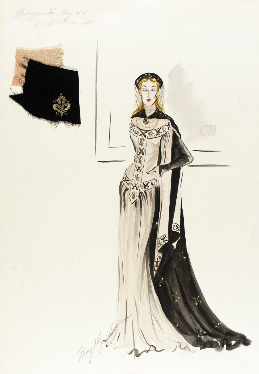 Costume sketch of a woman in a long dress with cape.