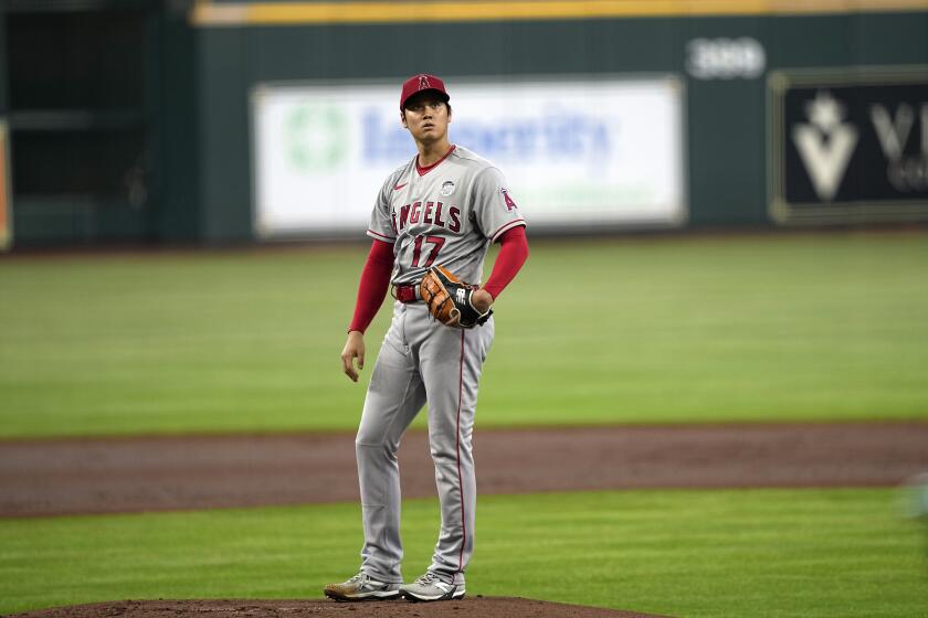 Angels pitcher Shohei Ohtani reacts after giving up a two-run homer to the Houston Astros' Yordan Álvarez on June 2, 2023.