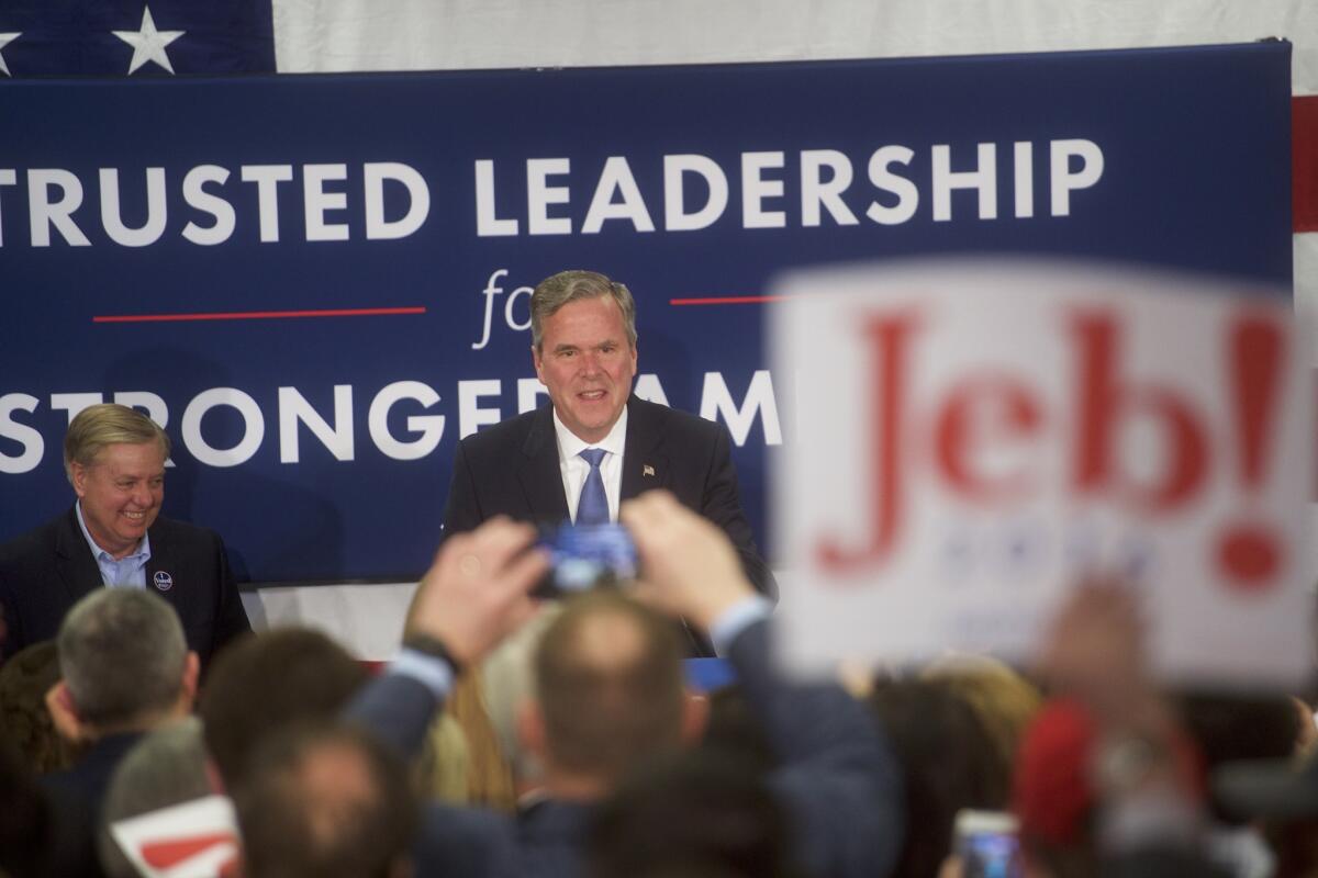 Jeb Bush takes the stage before announcing the suspension of his presidential campaign at an election night party in Columbia, S.C., on Feb. 20.