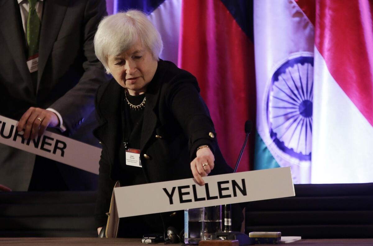 Federal Reserve Vice Chairwoman Janet L. Yellen places her name card at her seat at the International Monetary Conference in Shanghai.