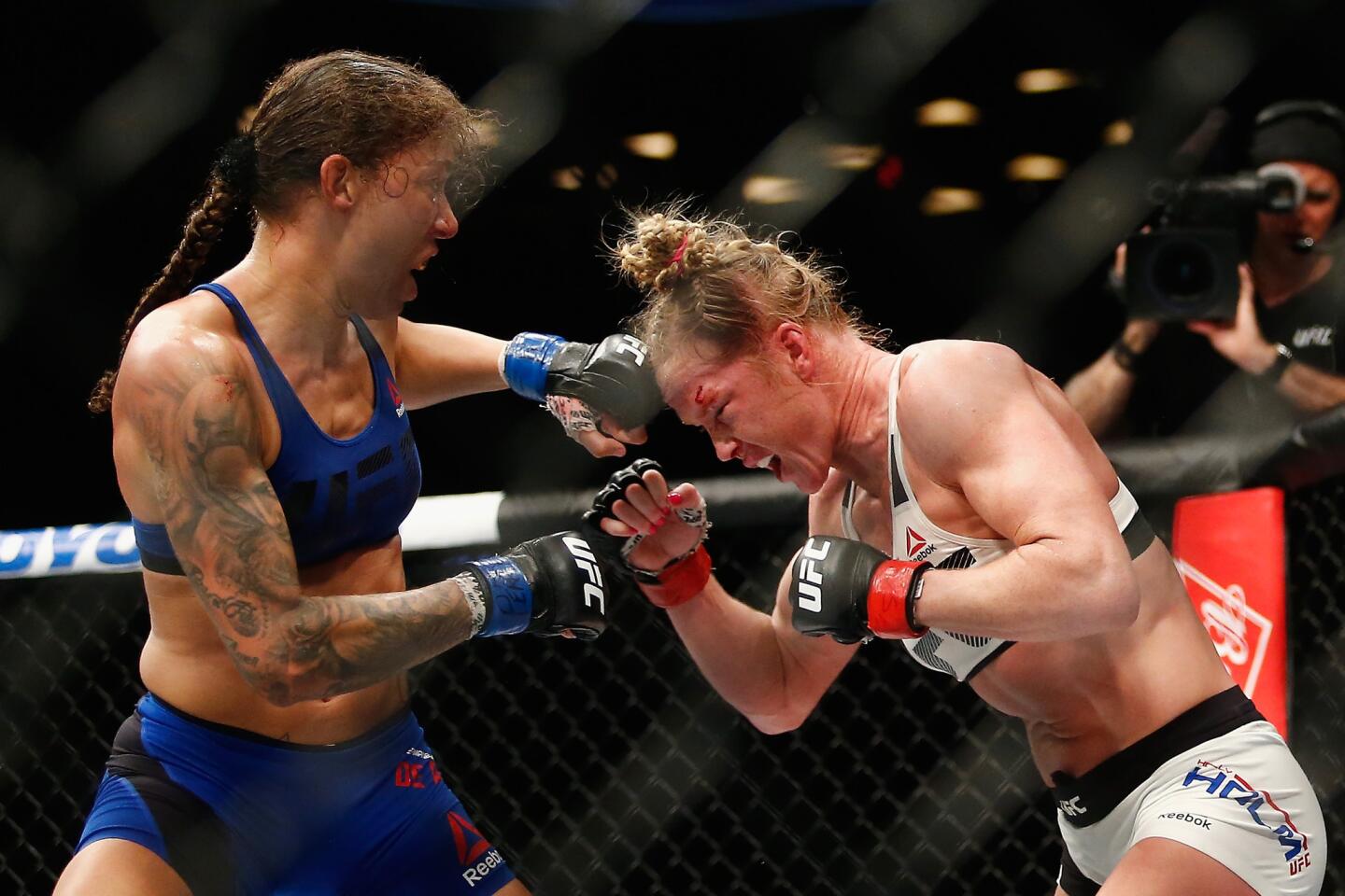 Germaine De Randamie and Holly Holm exchange blows during their featherweight title fight at Barclays Center in New York at UFC 208.