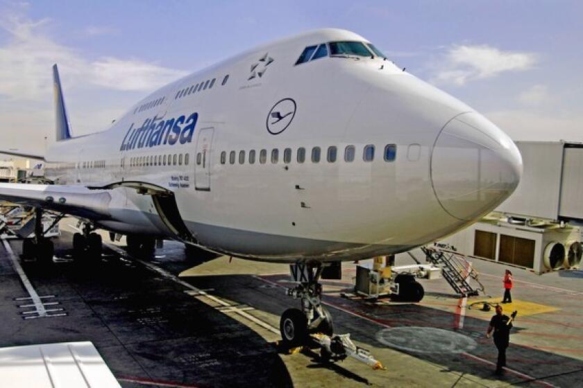 A Lufthansa 747-400 prepares for flight at LAX.