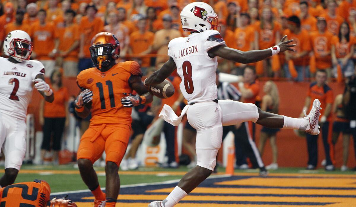 Louisville's Lamar Jackson high-steps into the end zone for a touchdown in the first quarter against Syracuse on Sept. 9.