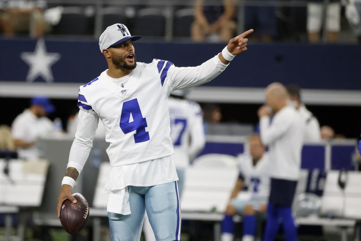 Dallas Cowboys quarterback Dak Prescott gestures before a preseason game against the Houston Texans.