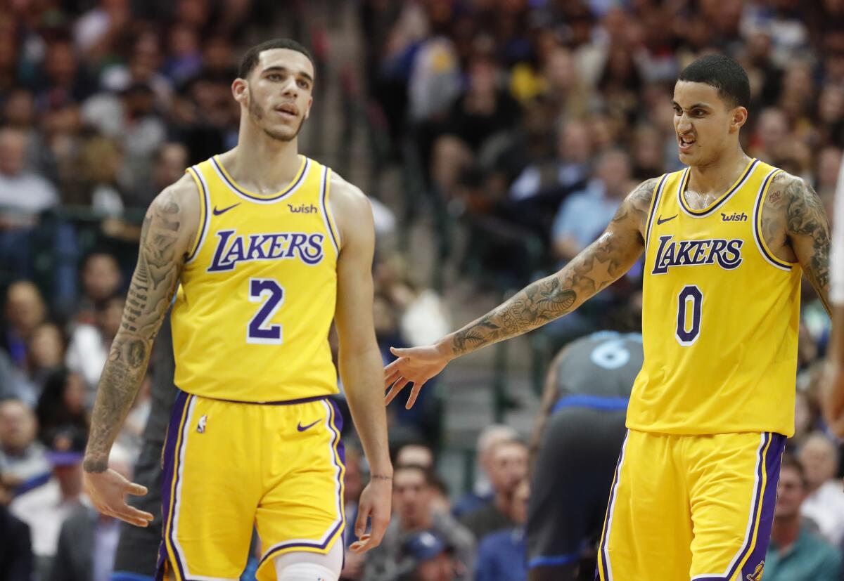 Los Angeles Lakers guard Lonzo Ball (2) and forward Kyle Kuzma (0) during the second half of an NBA basketball game against the Dallas Mavericks in Dallas, Monday, Jan. 7, 2019.