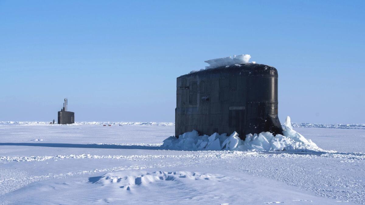 In this March 10 photo from the U.S. Navy, the fast-attack submarines USS Connecticut and USS Hartford break through ice in the Beaufort Sea. On June 29, the Associated Press found stories circulating online that a sea ice thickness map debunking global warming are untrue.