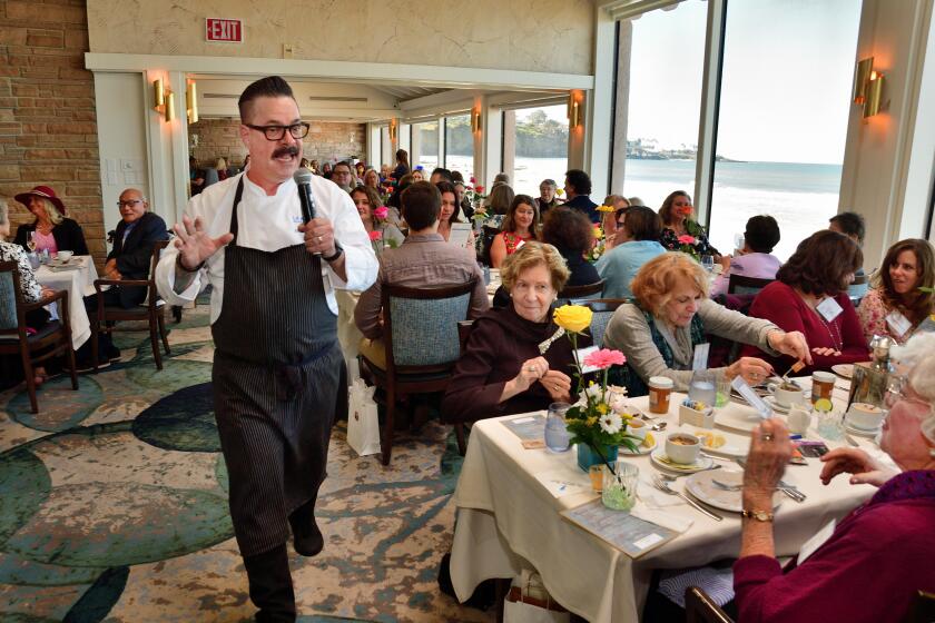 The Marine Room executive chef Mike Minor addresses guests at St. Madeleine Sophie's Center's "Tea by the Sea."