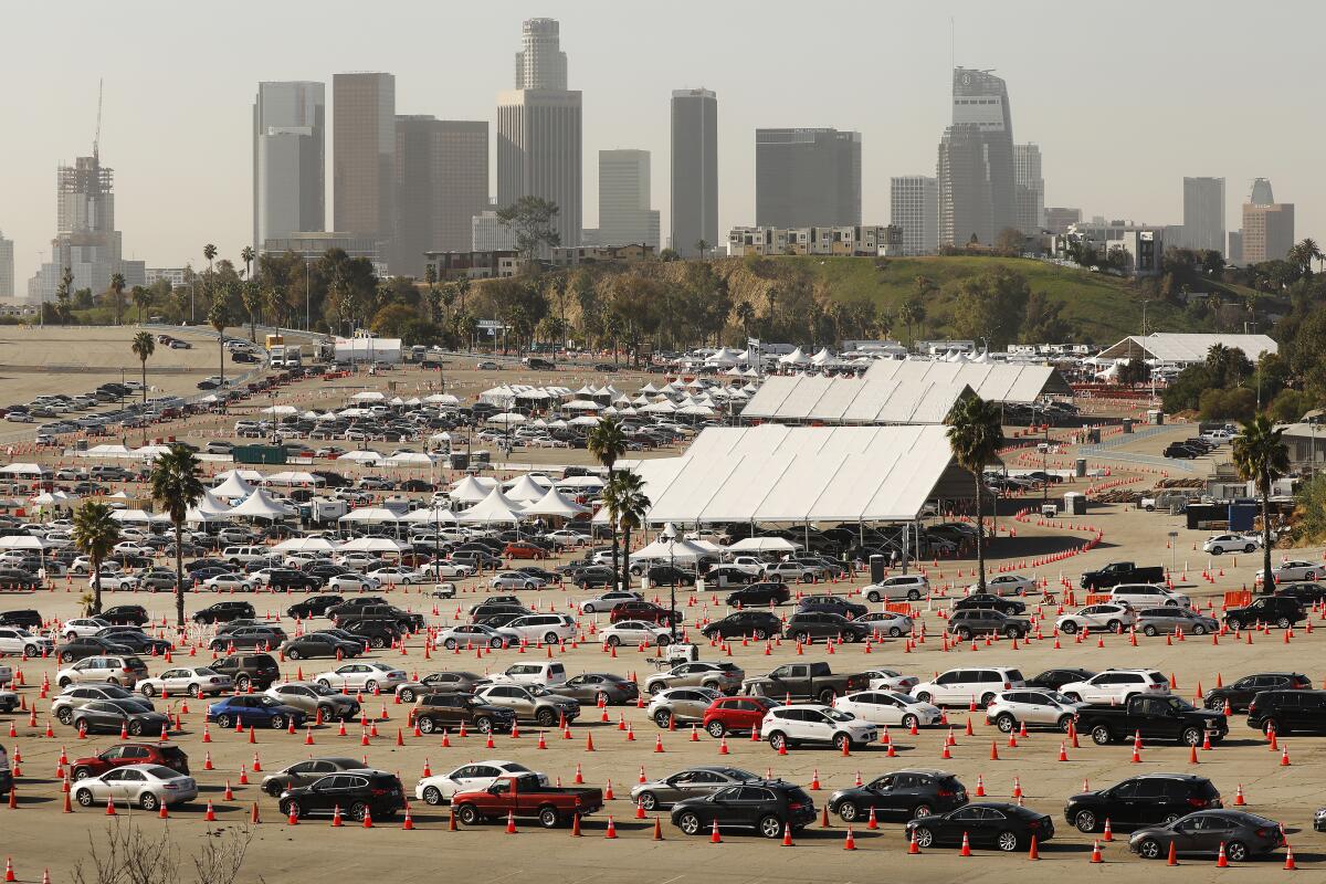 People in line for COVID-19 shot at Dodger Stadium