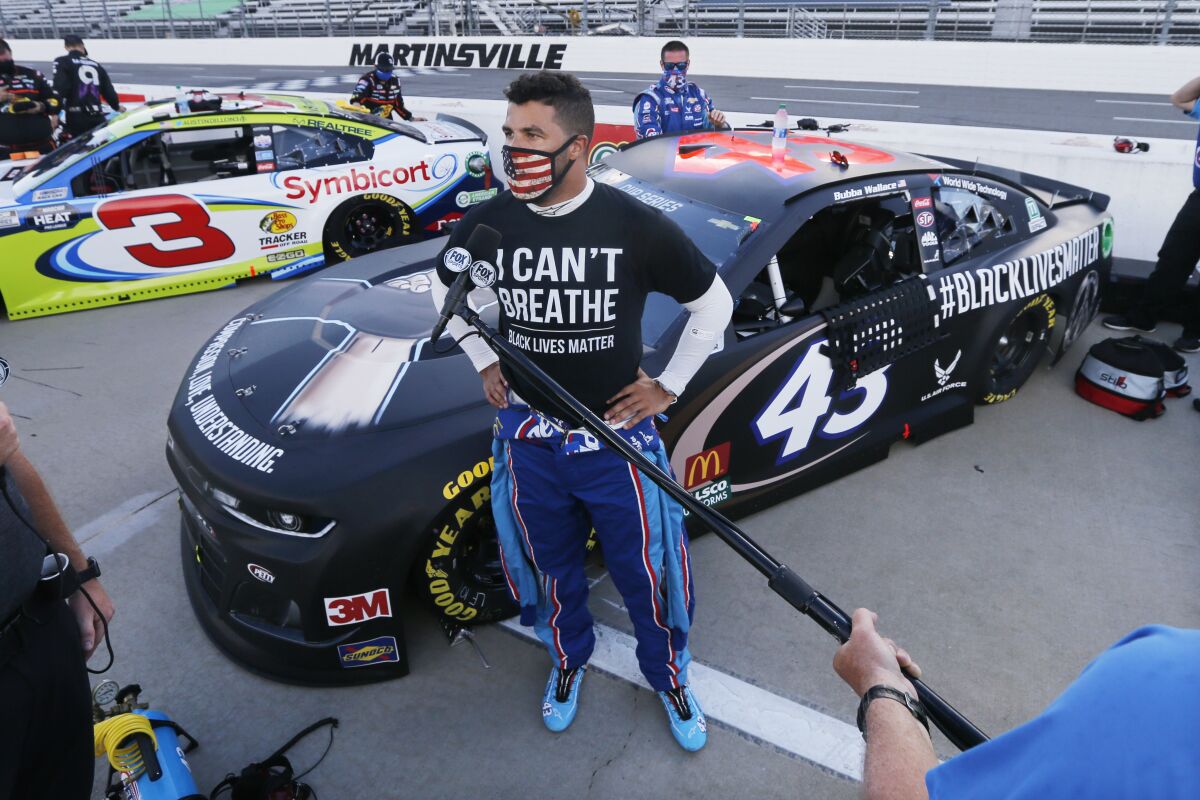 NASCAR driver Bubba Wallace is interviewed before the race Wednesday night at Martinsville Speedway in Virginia.