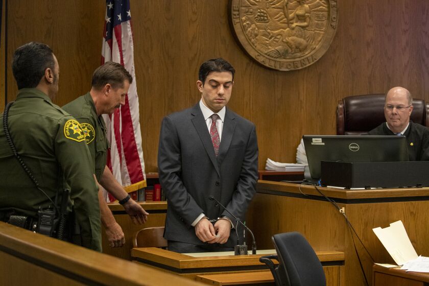 NEWPORT BEACH, CA - AUGUST 01, 2019 Ñ Hossein Nayeri takes the stand in his trial in a Newport Beach courthouse. Nayeri is accused of participating in a 2012 plot to abduct a marijuana dispensary owner who was taken to the Mojave desert, tortured and sexually mutilated. Prosecutors say the crime was motivated by the mistaken belief that the victim had hidden $1 million in the desert. (Irfan Khan/Los Angeles Times)